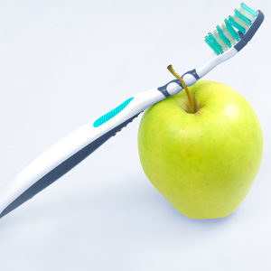 toothbrush on an apple